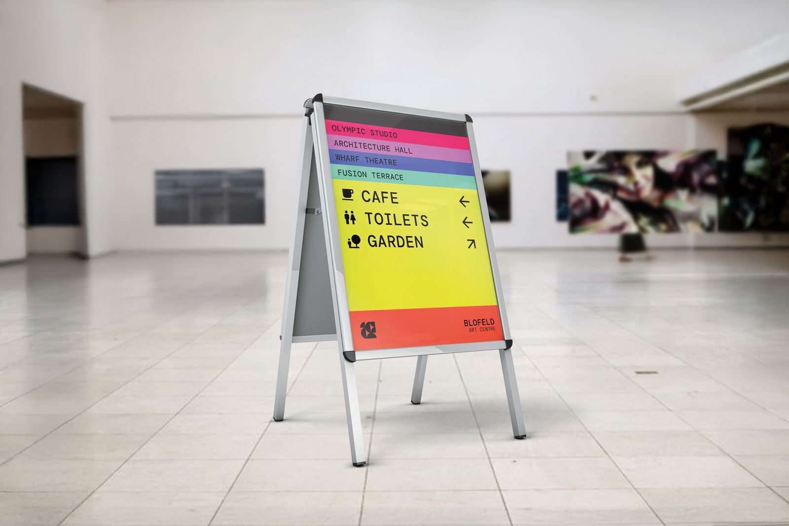 Aluminium A-frame with a colourful wayfinding poster in a gallery foyer