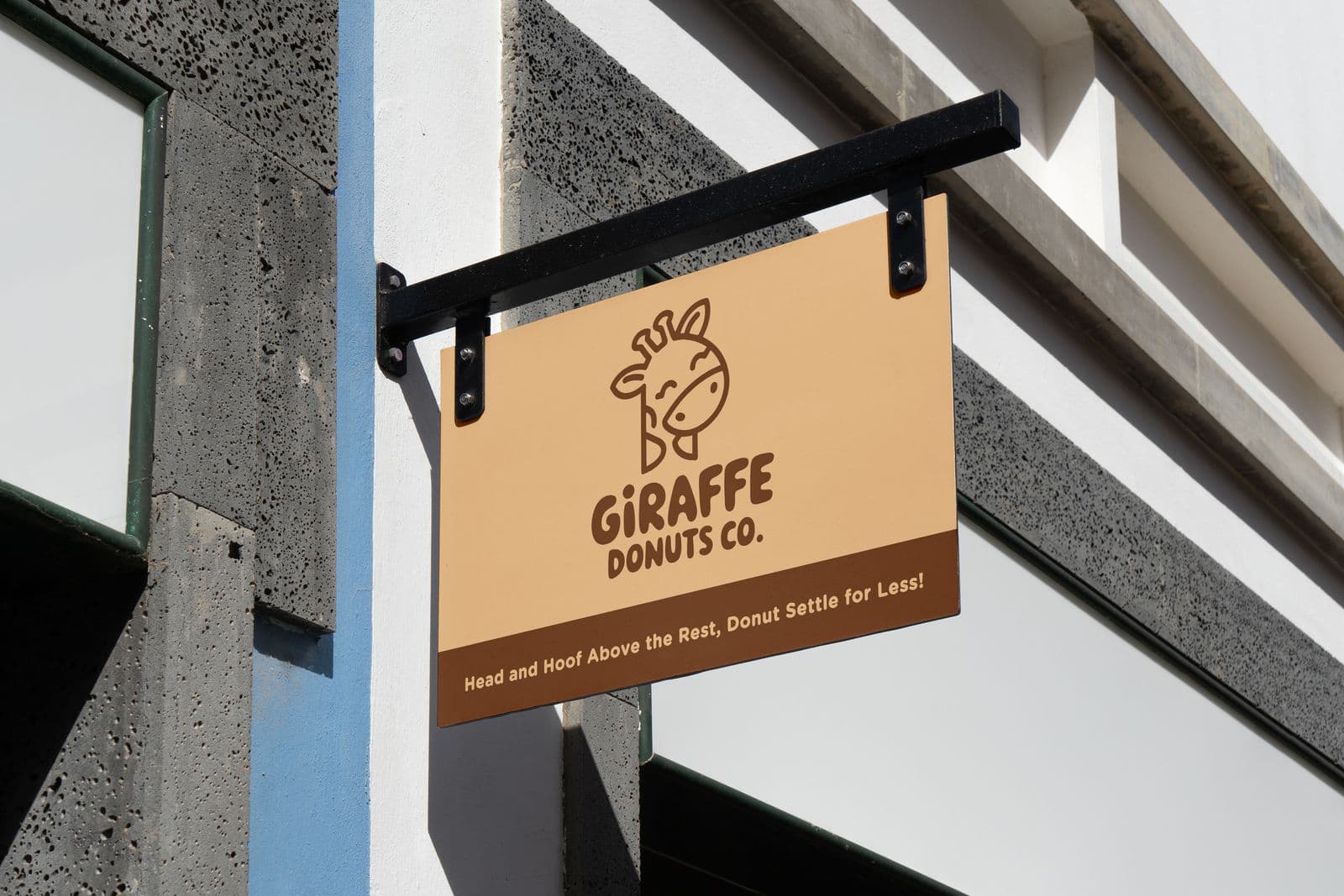 Aluminium composite sign for a doughnut shop hanging from a wall bracket