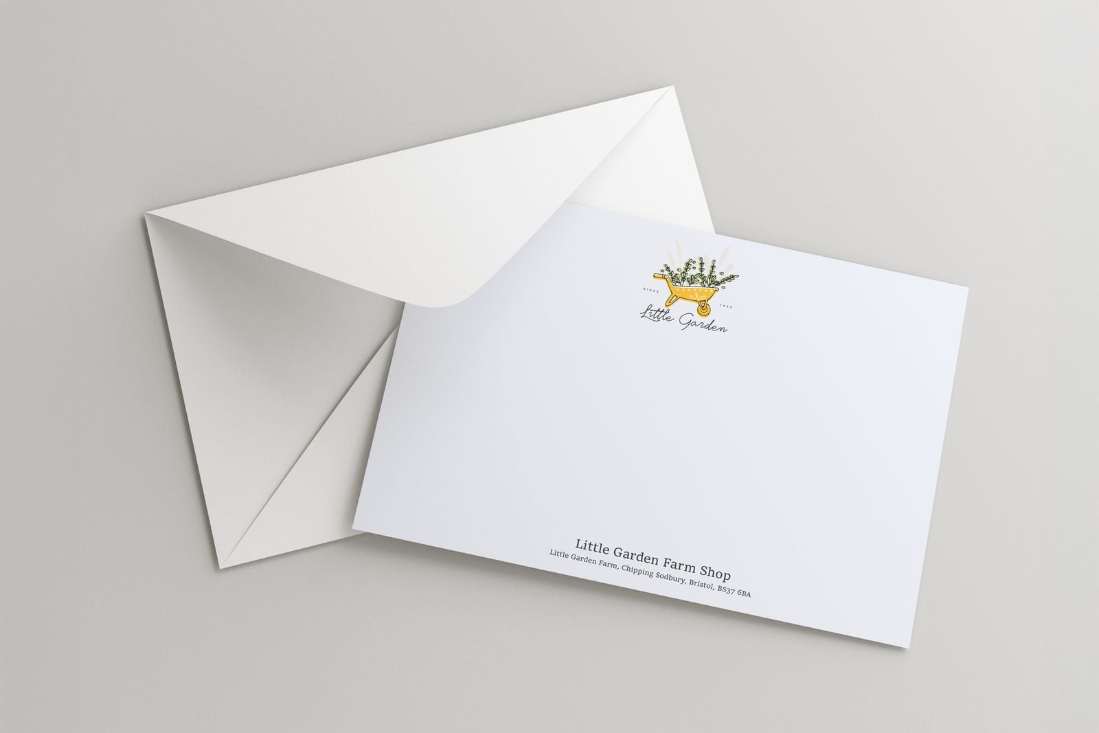 Farm shop correspondence card with a small logo, on an open envelope
