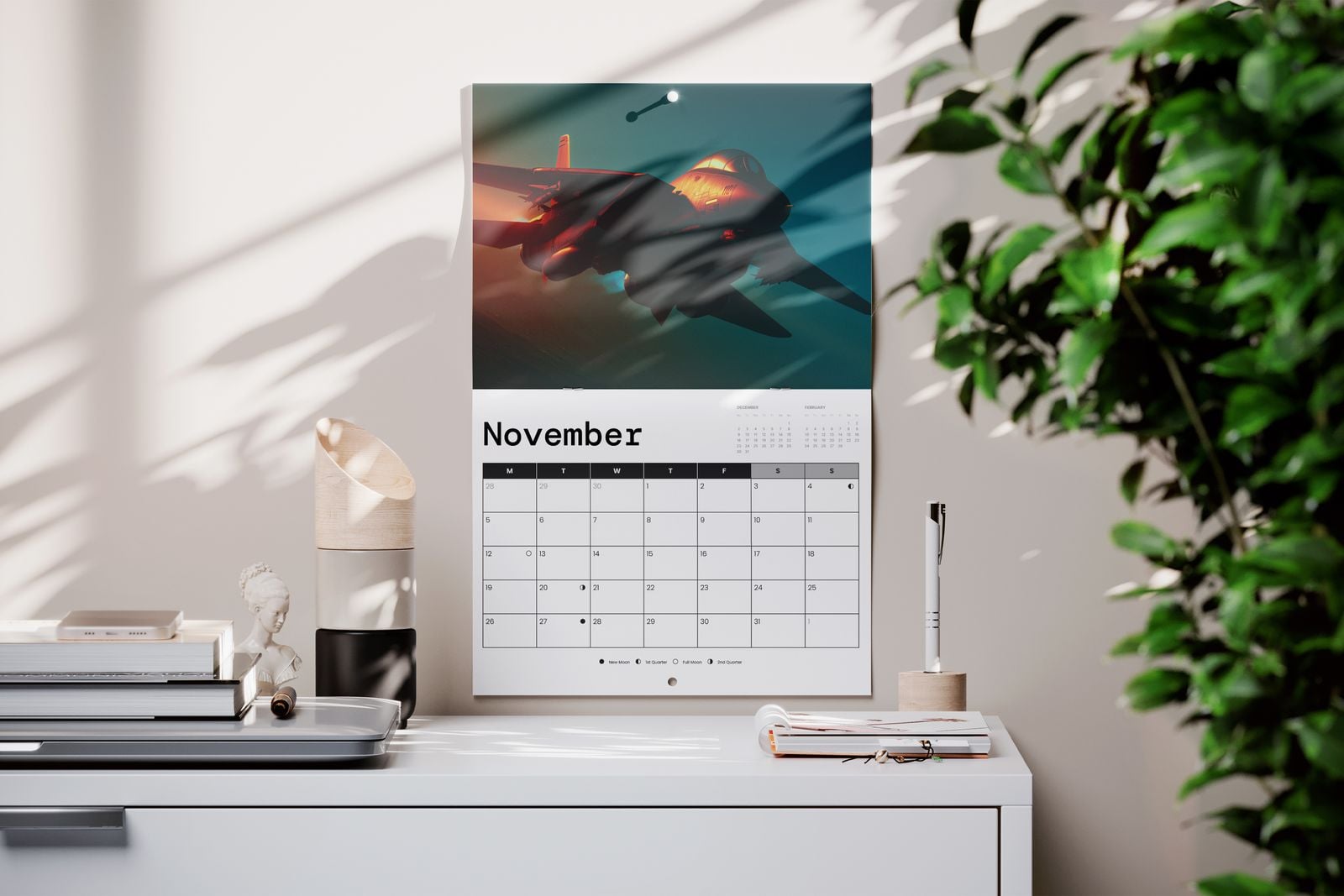 Drilled hole calendar open at November, hanging on a wall above a desk