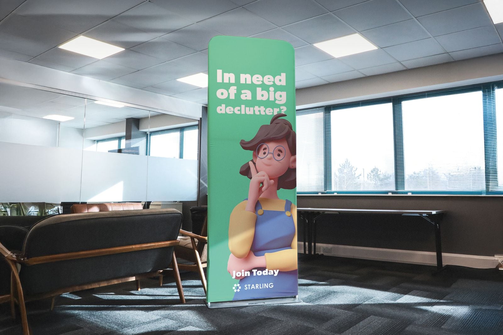 Green stretch fabric tube banner in an office break-out area