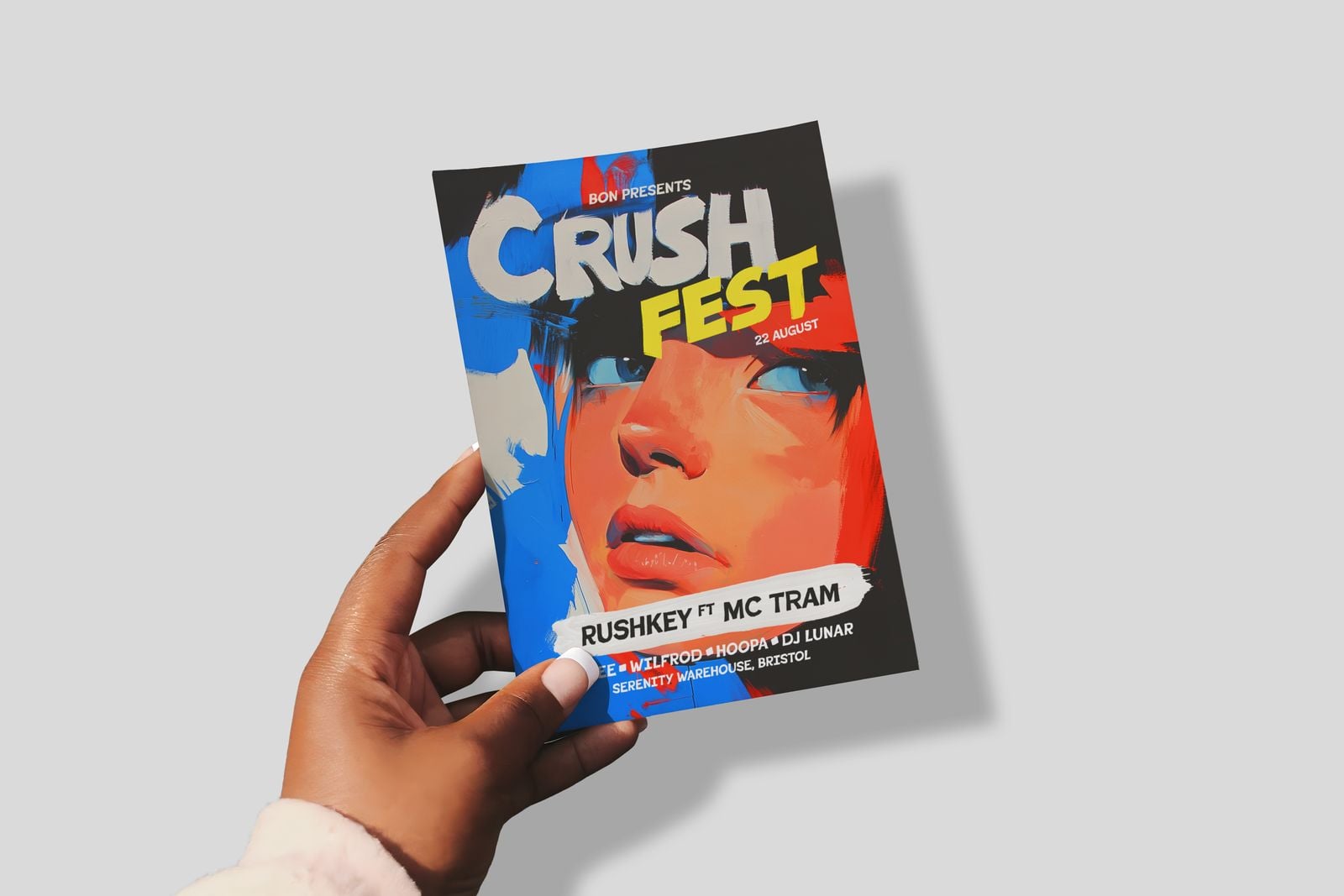A5 festival flyer held in a hand