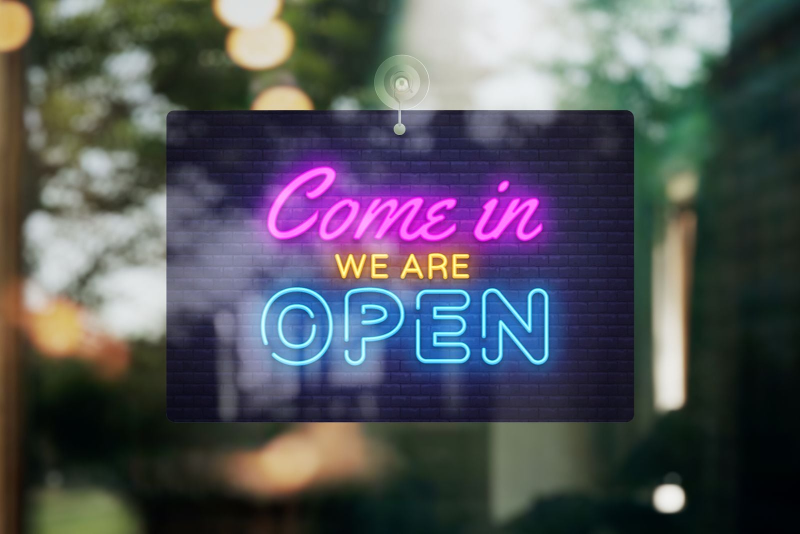 “Come in, we are open” foam PVC sign hanging in a shop window