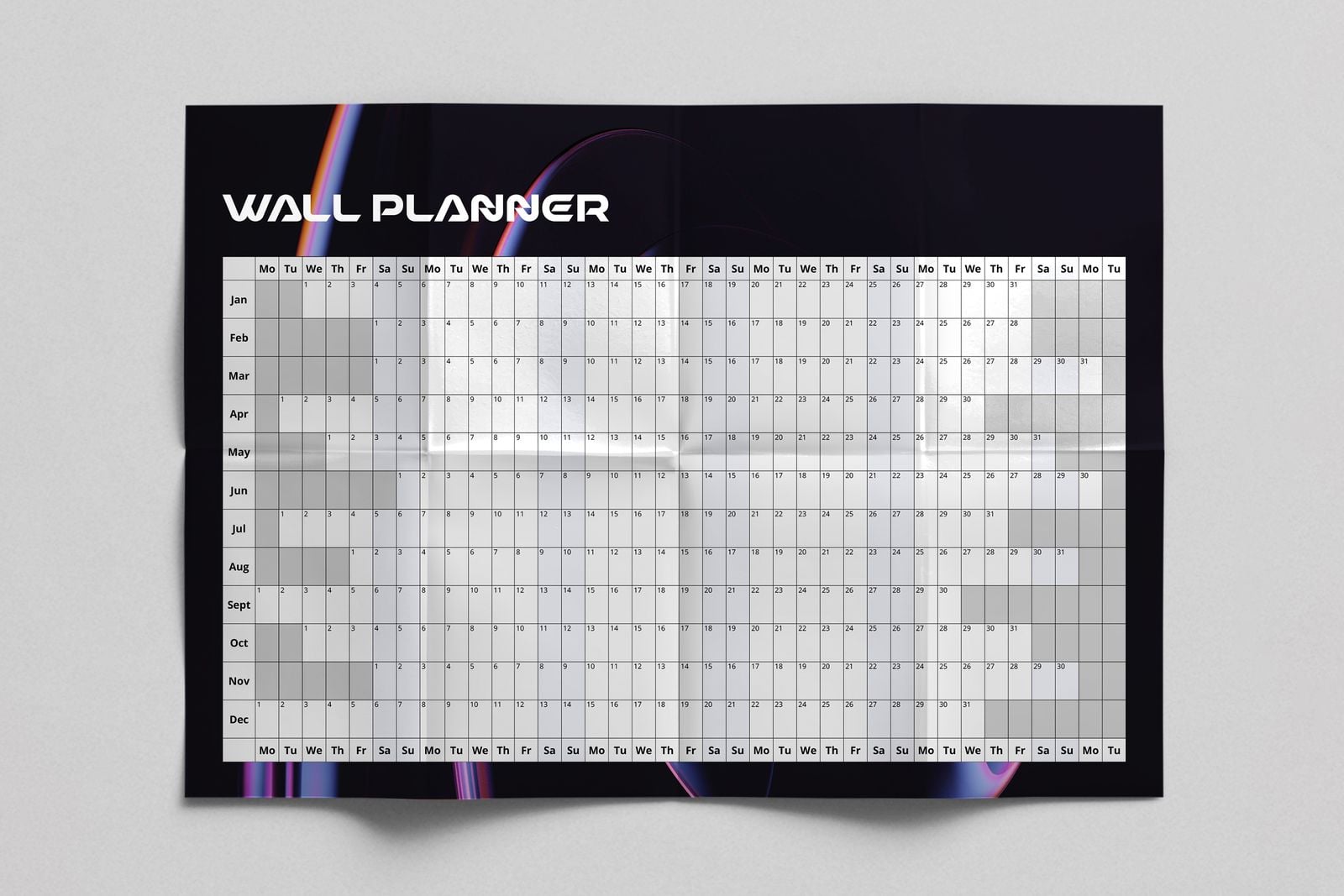 Black wall planner opened out flat, showing its fold creases