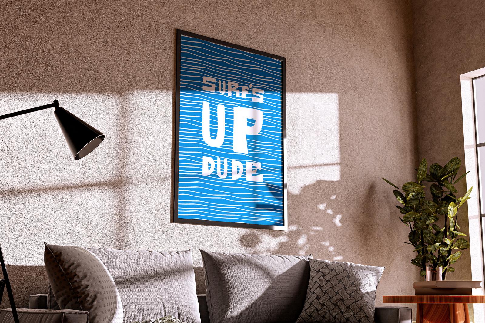 Large framed “Surf’s Up Dude” poster on a sunlit wall above a sofa