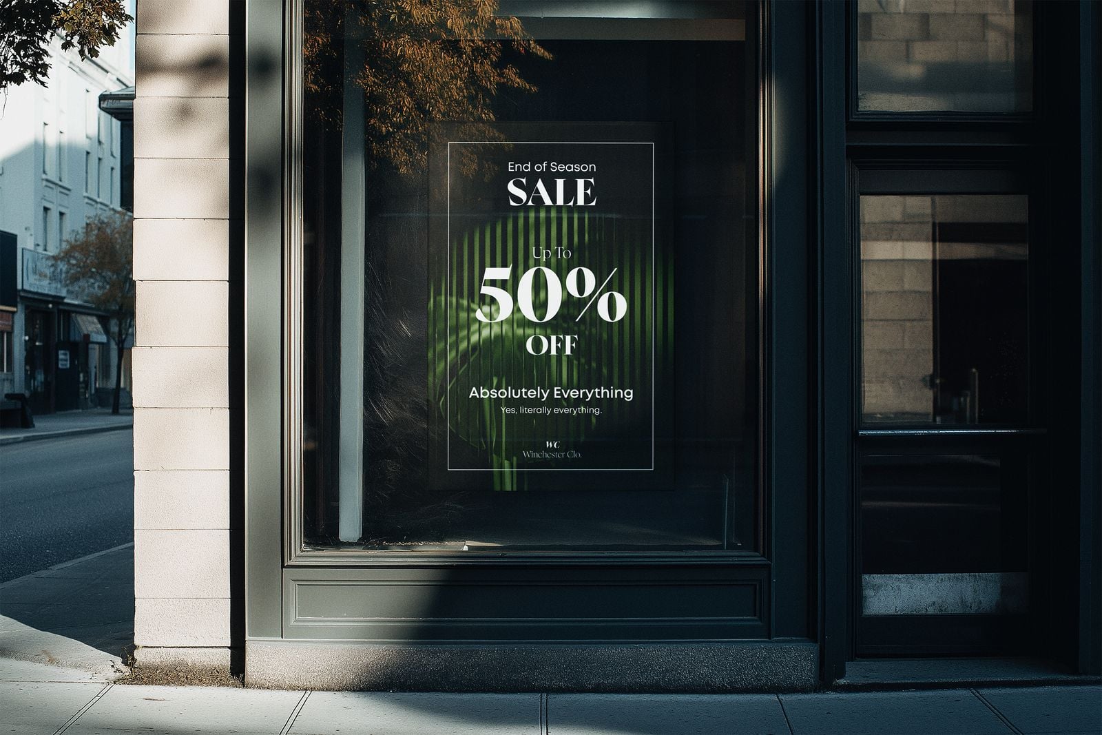 End of season sale poster displayed in a shop window