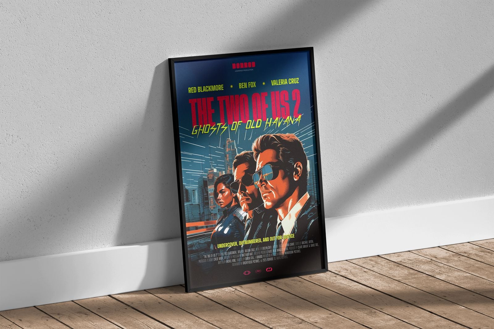 Framed retro action film poster leaning against a wall on a wooden floor