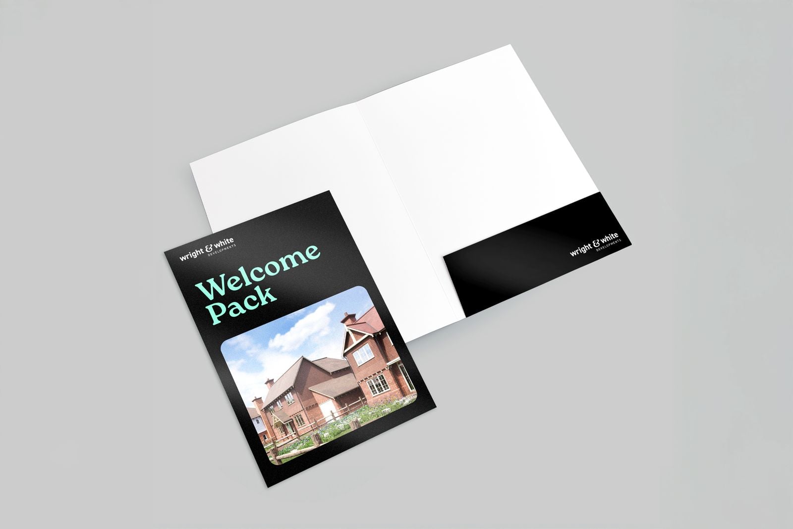 Black “Welcome Pack” presentation folder open to show the inside pocket