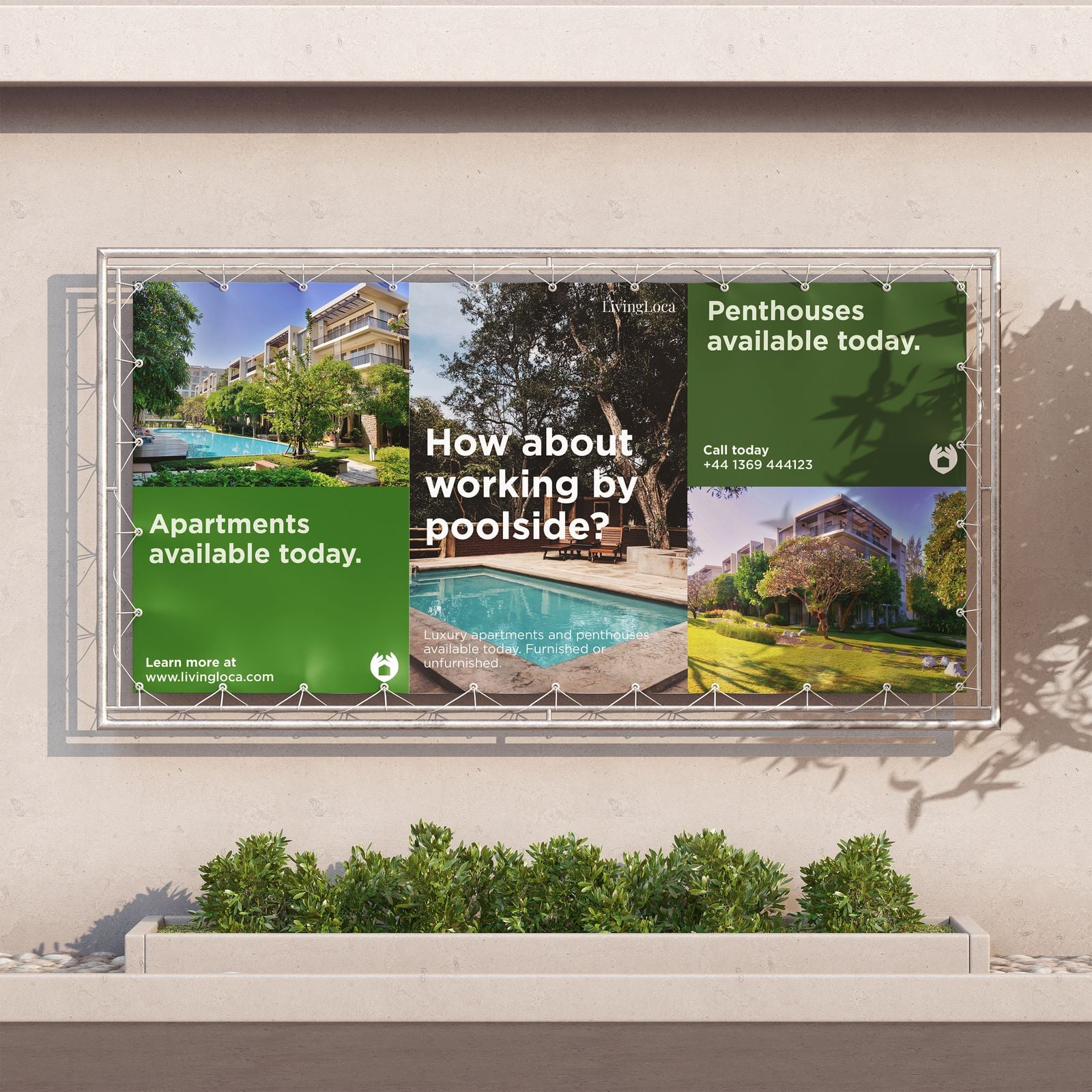 PVC banner advertising apartments, hung on a frame against a building wall