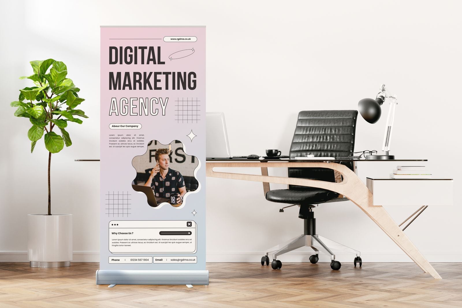 Standard roller banner for a marketing agency beside an office desk