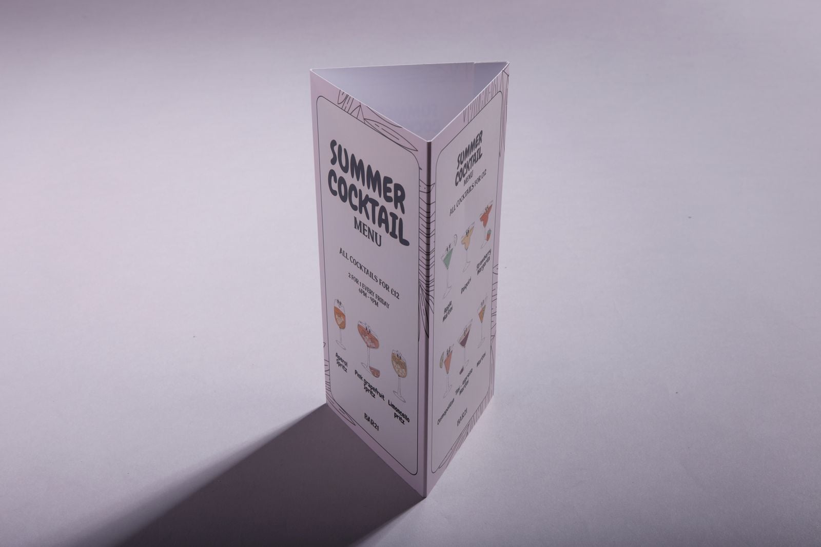 Summer cocktail menu table talker standing on a table