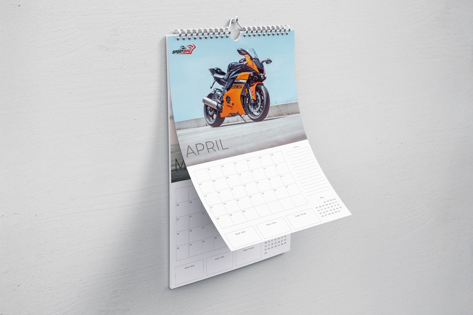 Wiro wall calendar with a motorbike photo, its April page lifting